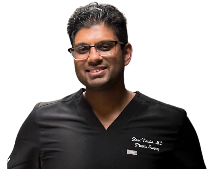 Ravia Viradia, MD smiles in black scrubs