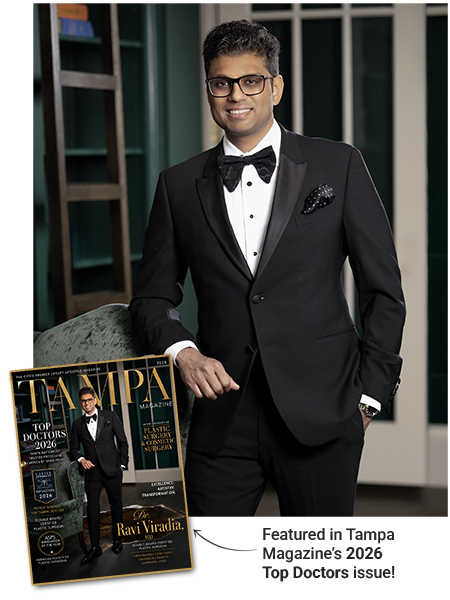 Dr. Viradia in a tuxedo with the Tampa Magazine cover he's featured on nearby.